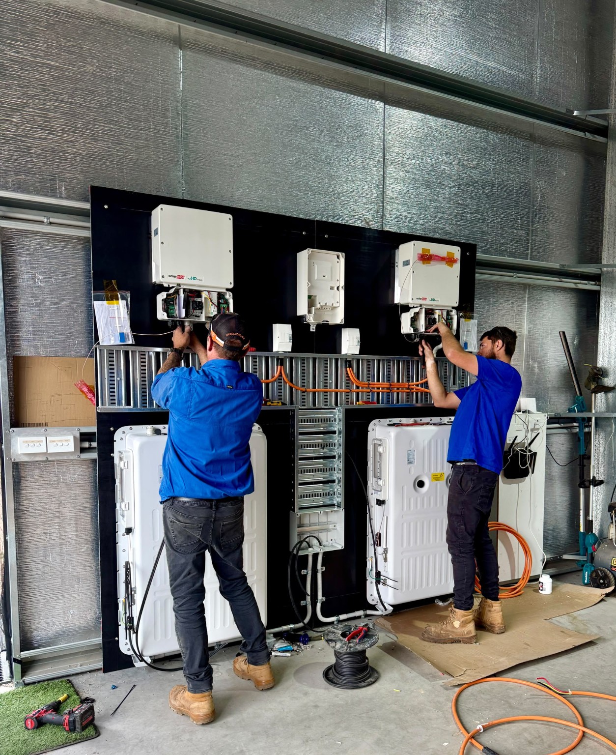 Swebs Electrical technicians working on an energy installation